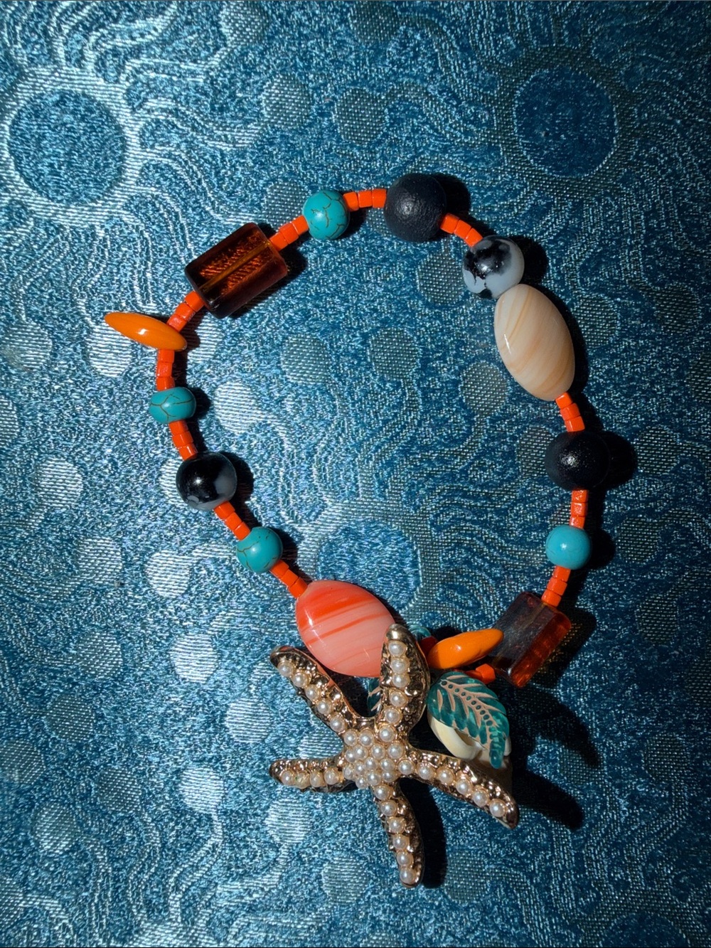 Beaded Starfish Charm Stretch Bracelet in Orange & Turquoise toned beads
